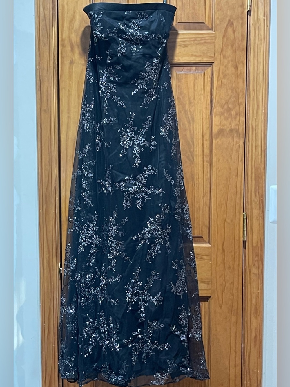 Elegant Black Strapless Prom Gown with Silver Floral Accents